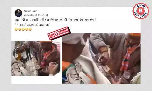नहीं, यह वीडियो तेलंगाना में पीएम मोदी की रैली में शराब बांटते नहीं दिखाता