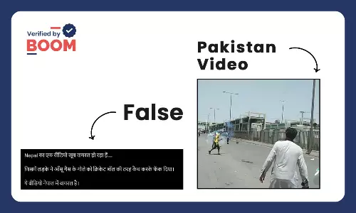 young man catching tear gas shells nepal